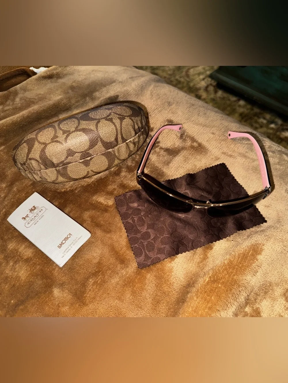 Coach aviator sunglasses with brown lenses and pink temples